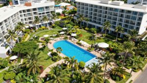 Mantra Broadbeach on the Park resort with pools and greenery.