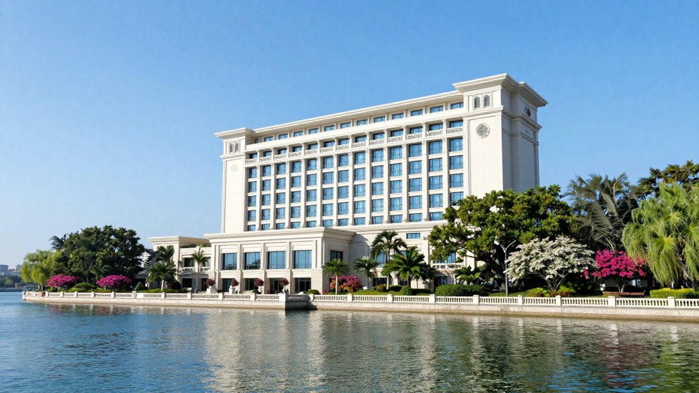 Oaks Hotel waterfront view with trees and flowers.