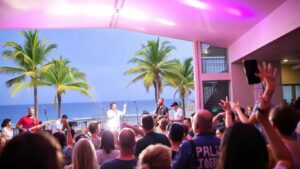 Live music performance at a Coolangatta venue with palm trees.