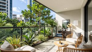 Modern apartment balcony with Brisbane skyline view.